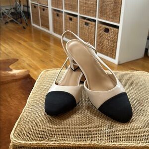 Chic Black and Cream Heels with Sleek Design